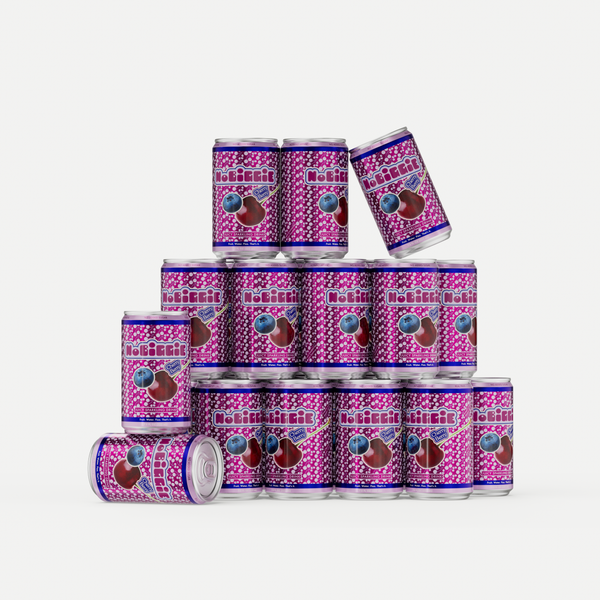 Stack of purple and pink "No Berries" beverage cans with berry graphics, arranged in a pyramid formation with some cans toppled over