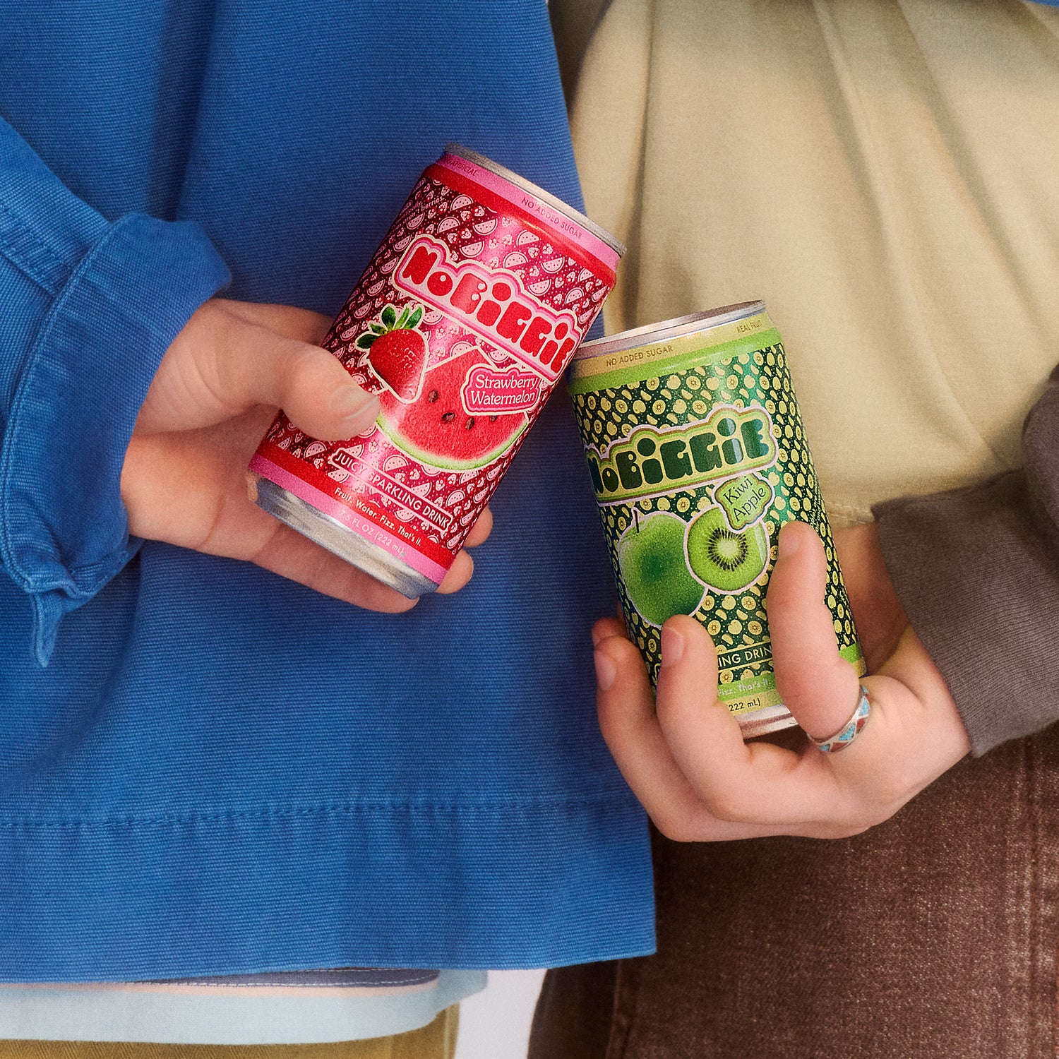 Two people holding Obrifit sparkling drinks - one red strawberry watermelon flavor, one green kiwi lime flavor - while wearing blue clothing